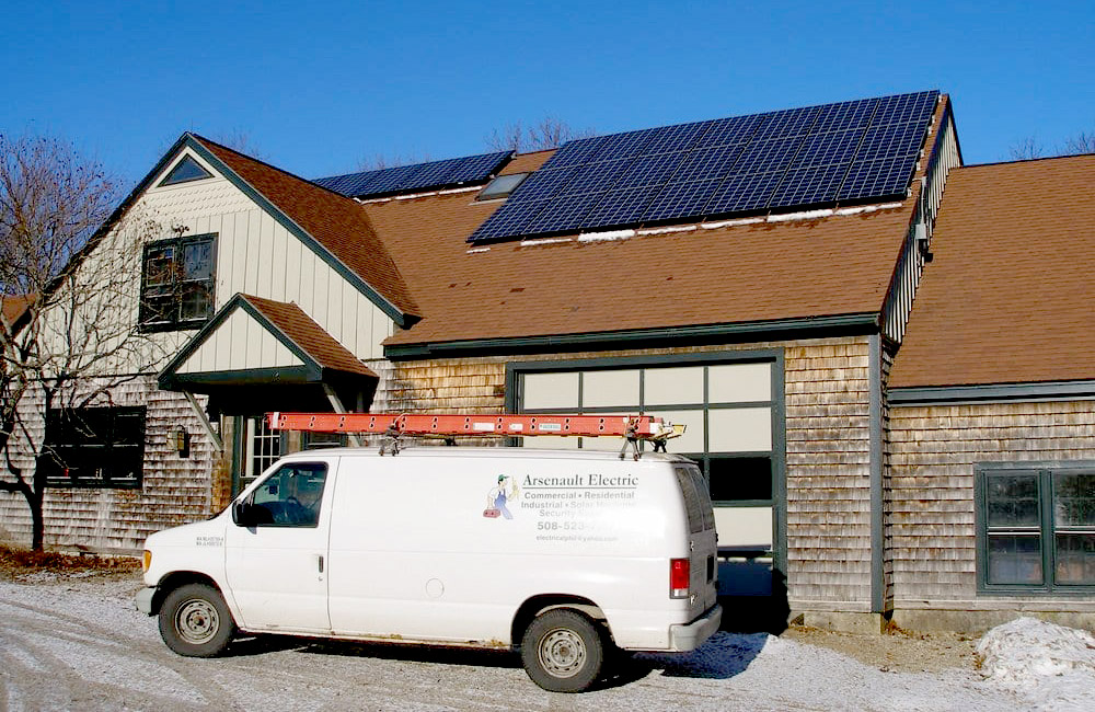 Arsenault Electric truck in front of house