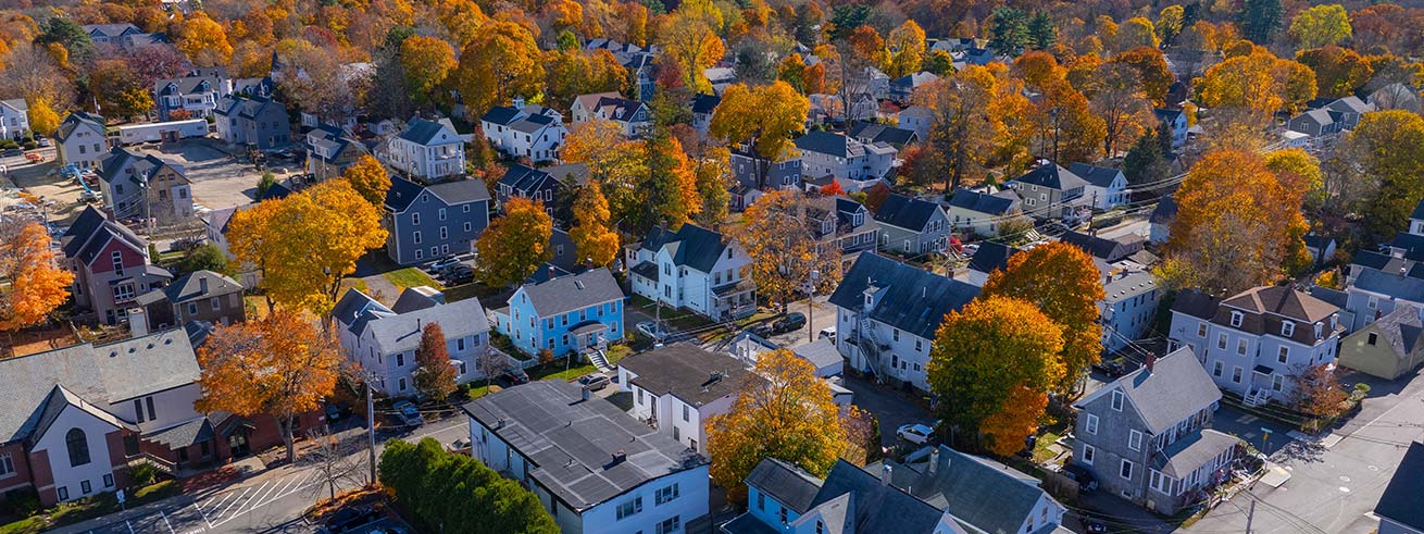 Historic residential houses aerial view in fall with foliage at historic town center of Natick, Massachusetts MA, USA
