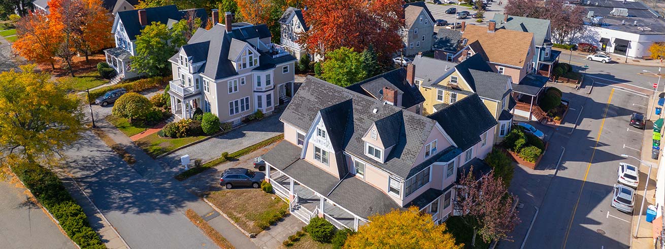 Historic residential houses aerial view in fall with foliage in historic town center of Wellesley, Massachusetts MA, USA